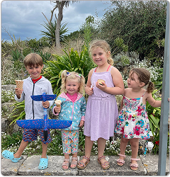 Four children together in a garden